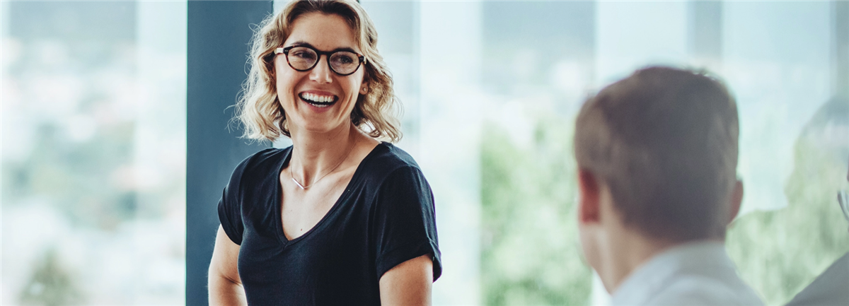 Woman smiling at colleague